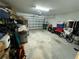 Attached garage with ample space for storage and vehicles at 6300 Beverly Hills Dr, Zephyrhills, FL 33541