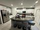 Modern kitchen with granite counters and white cabinets at 6300 Beverly Hills Dr, Zephyrhills, FL 33541