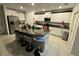 Modern kitchen with granite counters and white cabinets at 6300 Beverly Hills Dr, Zephyrhills, FL 33541