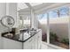 Bathroom with natural light, vanity, granite countertops, and access to a private outdoor space at 7233 15Th Ne Ct, St Petersburg, FL 33702