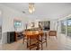 Dining area features mid-century modern furniture and seamless access to a living area at 7233 15Th Ne Ct, St Petersburg, FL 33702