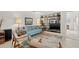 Living room features a built-in bookshelf, modern furnishings, and access to a hallway at 7233 15Th Ne Ct, St Petersburg, FL 33702