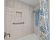 Clean bathroom shower with a grab bar, built-in soap niche, and a shower curtain at 7233 15Th Ne Ct, St Petersburg, FL 33702