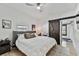 Main bedroom with king bed and barn door to en suite at 8405 N Arden Ave, Tampa, FL 33604