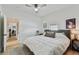 Main bedroom with a king-size bed and ceiling fan at 8405 N Arden Ave, Tampa, FL 33604