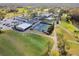 Aerial view of community tennis courts and clubhouse at 9214 Golf View Dr, New Port Richey, FL 34655