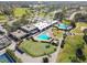 Aerial view of community clubhouse, pools, and golf course at 9214 Golf View Dr, New Port Richey, FL 34655