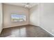 Bright bedroom with wood flooring and ceiling fan at 9214 Golf View Dr, New Port Richey, FL 34655