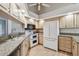 Well-equipped kitchen with white appliances and granite counters at 9214 Golf View Dr, New Port Richey, FL 34655