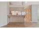 Kitchen features light wood cabinets and granite countertops at 9214 Golf View Dr, New Port Richey, FL 34655