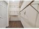 Large walk-in closet with double hanging rods at 9214 Golf View Dr, New Port Richey, FL 34655