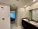 Double vanity bathroom with a large walk-in shower at 13621 Willow Bluestar Loop, Riverview, FL 33579