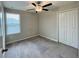 Spacious bedroom with ceiling fan and double door closet at 13621 Willow Bluestar Loop, Riverview, FL 33579