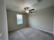 Bright bedroom with ceiling fan and window coverings at 13621 Willow Bluestar Loop, Riverview, FL 33579