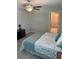 Bedroom with a king-size bed, en-suite bathroom and walk-in closet at 13621 Willow Bluestar Loop, Riverview, FL 33579