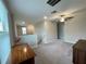 Bright and airy bonus room featuring a ceiling fan and a convenient desk area at 13621 Willow Bluestar Loop, Riverview, FL 33579
