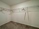 Large walk-in closet with wire shelving at 13621 Willow Bluestar Loop, Riverview, FL 33579