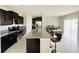 Spacious kitchen with an island, stainless steel appliances, and granite countertops at 13621 Willow Bluestar Loop, Riverview, FL 33579