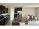 Kitchen with island, stainless steel appliances, and granite countertops at 13621 Willow Bluestar Loop, Riverview, FL 33579