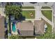 Aerial view of a house with a pool and detached garage at 13945 75Th Ave, Seminole, FL 33776