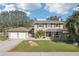 Two-story house with a two-car garage and large yard at 13945 75Th Ave, Seminole, FL 33776