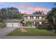 Two-story house with a two-car garage and large yard at 13945 75Th Ave, Seminole, FL 33776