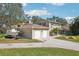 Two-story house with a two-car garage and boat at 13945 75Th Ave, Seminole, FL 33776