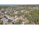Aerial view showcasing a charming house with a pool, nestled in a quiet neighborhood near the water at 13945 75Th Ave, Seminole, FL 33776
