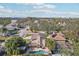 Aerial view of a house with a pool and patio; ocean view in the distance at 13945 75Th Ave, Seminole, FL 33776
