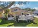 Home exterior showcasing a boat parked on a grassy area at 13945 75Th Ave, Seminole, FL 33776