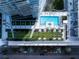 Aerial view of resort-style pool, green spaces, and modern building at 175 1St S St # 3402, St Petersburg, FL 33701