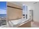 Luxurious bathroom featuring a soaking tub with stunning city views at 175 1St S St # 3402, St Petersburg, FL 33701