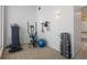 In-home fitness area with elliptical, weights, and exercise ball at 175 1St S St # 3402, St Petersburg, FL 33701