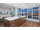 Modern kitchen with island, quartz countertops, and city views at 175 1St S St # 3402, St Petersburg, FL 33701