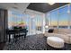Sophisticated living room with grand piano, chandelier, and stunning city views at 175 1St S St # 3402, St Petersburg, FL 33701
