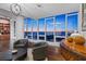 Luxury sitting area with water views, dark wood floors and stylish furnishings at 175 1St S St # 3402, St Petersburg, FL 33701