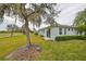 Private backyard with lush landscaping, backing up to a golf course at 2438 Sifield Greens Way # 44, Sun City Center, FL 33573