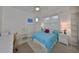 Cozy bedroom with a queen-size bed and built-in shelving at 2438 Sifield Greens Way # 44, Sun City Center, FL 33573