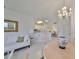 Dining area with round table and view into living room and kitchen at 2438 Sifield Greens Way # 44, Sun City Center, FL 33573