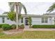 Back exterior view, screened-in porch, landscaping at 2438 Sifield Greens Way # 44, Sun City Center, FL 33573