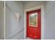Inviting red front door entryway at 2438 Sifield Greens Way # 44, Sun City Center, FL 33573