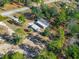 Aerial view of the property showing house and trees at 25888 Whipperwill St, Brooksville, FL 34601