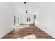 Spacious bedroom with hardwood floors and access to a back patio at 25888 Whipperwill St, Brooksville, FL 34601