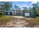 Newly renovated home with detached garage, sunroom and large backyard at 25888 Whipperwill St, Brooksville, FL 34601