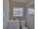 Clean bathroom with white vanity and single toilet at 2701 W Cordelia St, Tampa, FL 33607