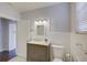 Updated bathroom with gray vanity and white tile at 2701 W Cordelia St, Tampa, FL 33607