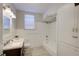 Clean bathroom with a tub and built-in shelving at 2701 W Cordelia St, Tampa, FL 33607
