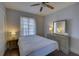 Bedroom with dresser, ceiling fan, and large window at 2701 W Cordelia St, Tampa, FL 33607