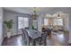 Elegant dining room with a rustic table and chandelier at 2701 W Cordelia St, Tampa, FL 33607