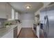 Modern kitchen with white cabinets, granite countertops and stainless steel appliances at 2701 W Cordelia St, Tampa, FL 33607